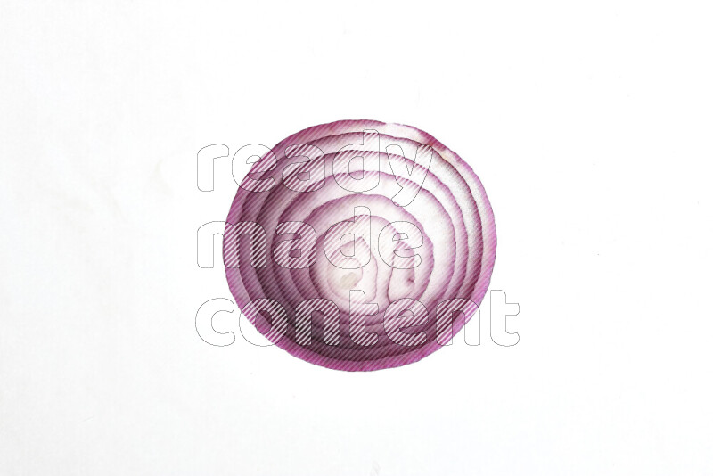 Onion slices on illuminated white background