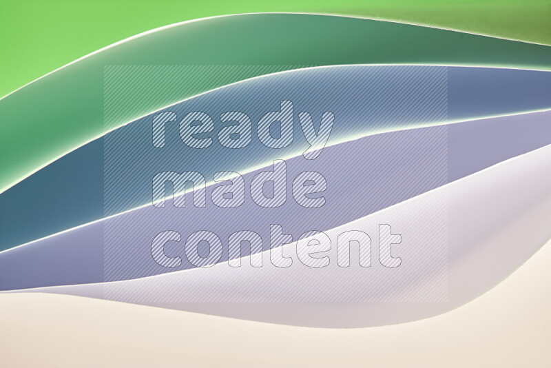 This image showcases an abstract paper art composition with paper curves in green and white gradients created by colored light