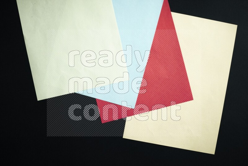 Multicolored paper sheet on black background