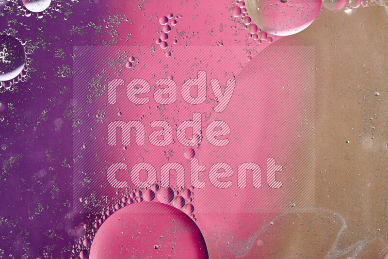 Close-ups of abstract oil bubbles on water surface in shades of brown, purple and pink