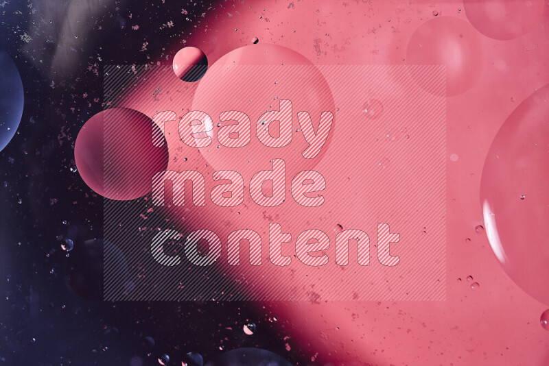 Close-ups of abstract oil bubbles on water surface in shades of black and pink