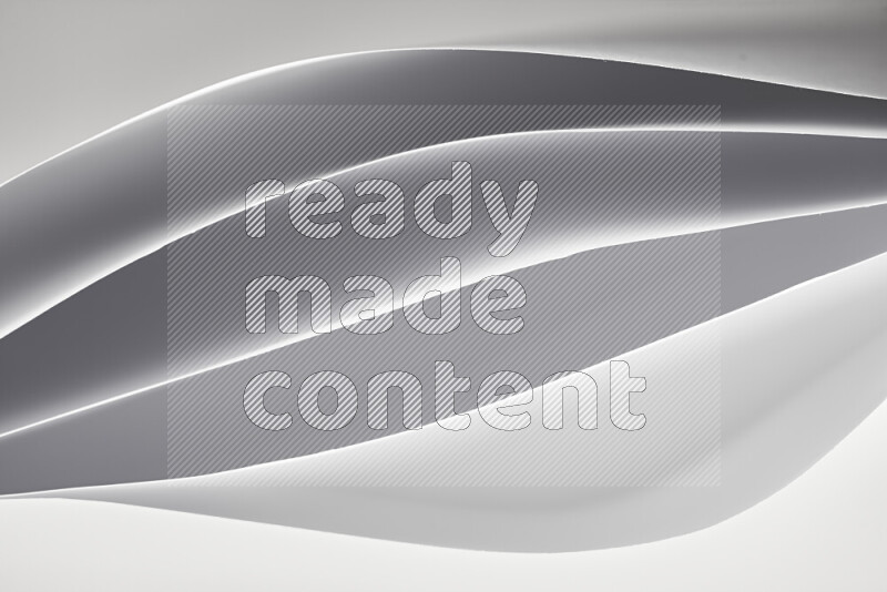 This image showcases an abstract paper art composition with paper curves in white created by light