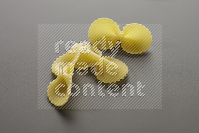 Fiocchi pasta on grey background