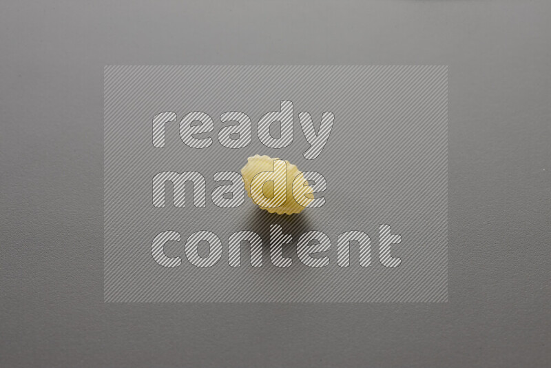 Shells pasta on grey background