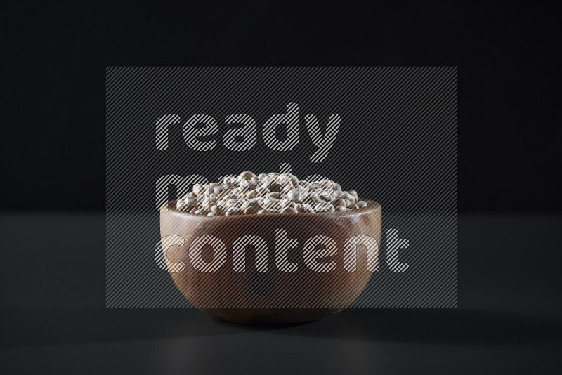 Lupin Beans in a wooden bowl on grey background