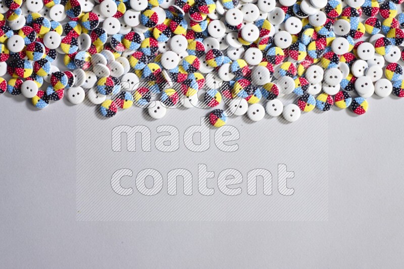 Multicolored buttons placed on grey background