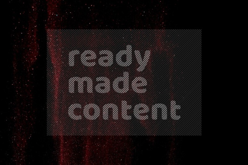 Red glitter powder isolated on black background