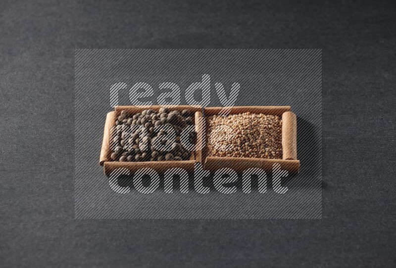 2 squares of cinnamon sticks full of mustard seeds and allspice on black flooring