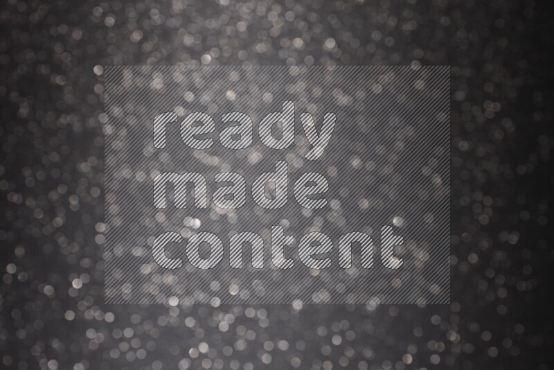 Black glittery bokeh background