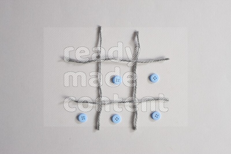 Blue buttons placed on grey background