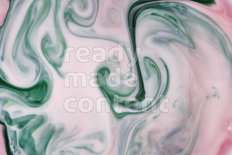 A close-up of abstract swirling patterns in red and green
