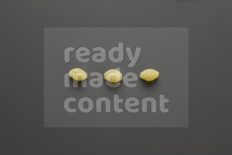 Shells pasta on grey background