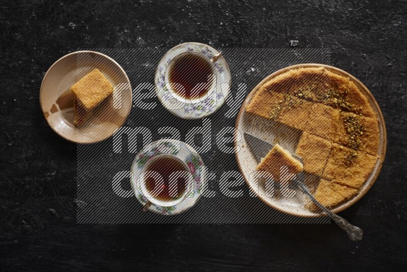konafa with tea in a dark setup