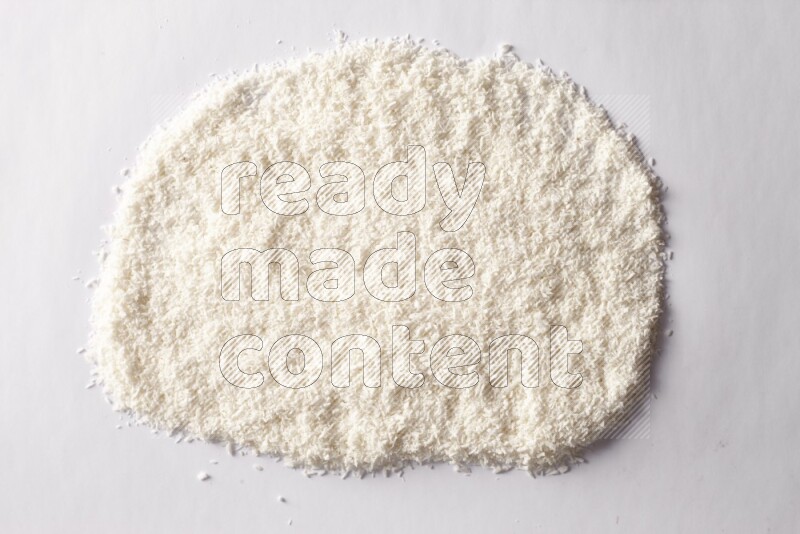 Desiccated coconuts on white background