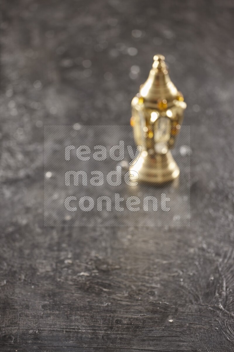 An out of focus lantern on textured black background