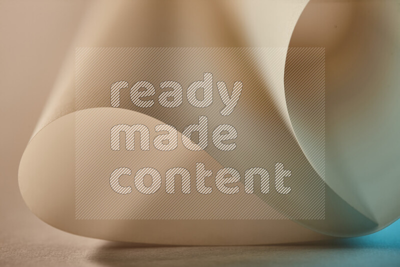 An abstract art piece displaying smooth curves in blue and gold gradients created by colored light