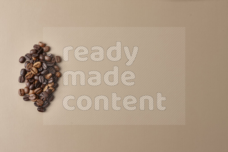 Assorted kinds of coffee such as roasted beans and ground on beige background