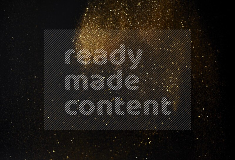 Gold glitter powder isolated on black background