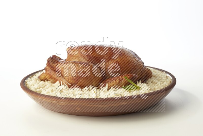white  basmati Rice with  whole roasted chicken    on a pottery plate  direct  on white background