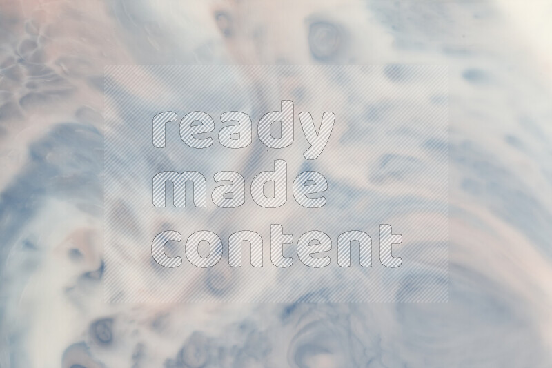 A close-up of abstract swirling patterns in blue, red and white