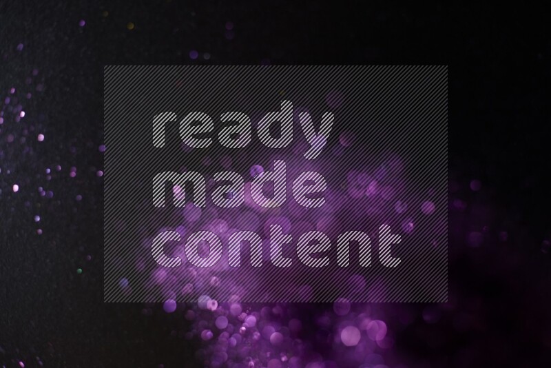 Purple glitter powder isolated on black background