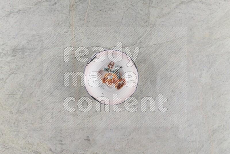 A vintage metal plate on grey marble background