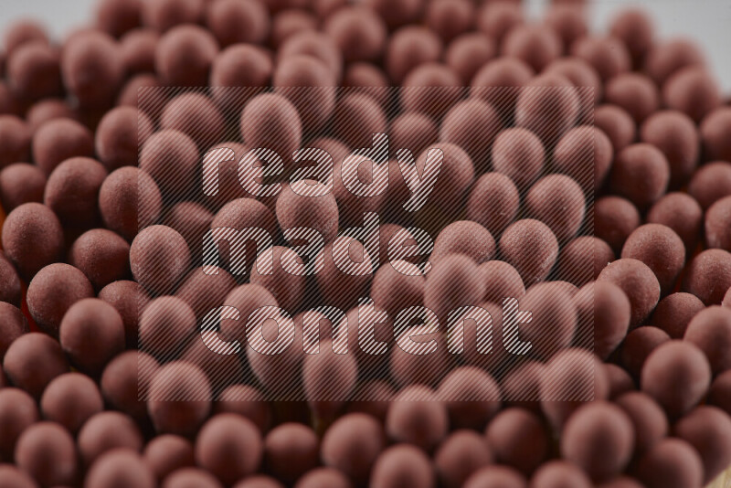 A close-up of a bundle of matches on grey background