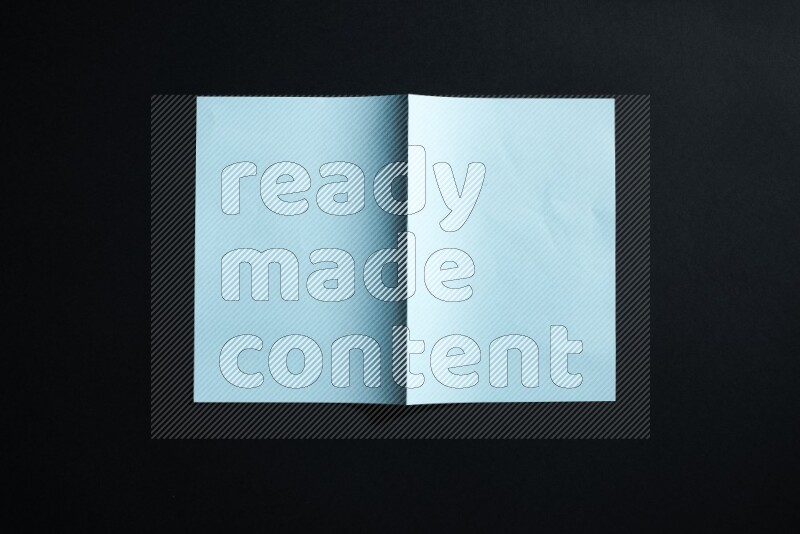 Blue paper sheet on black background