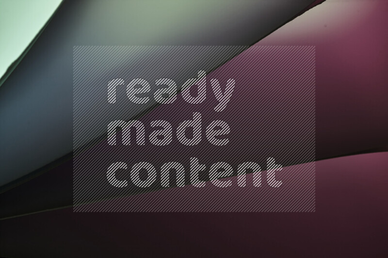 An abstract art piece displaying smooth curves in warm and cold gradients created by colored light