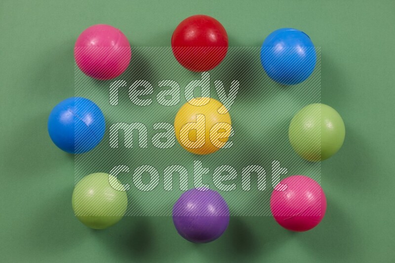 Multicolored plastic balls on different colored backgrounds (kids toys)