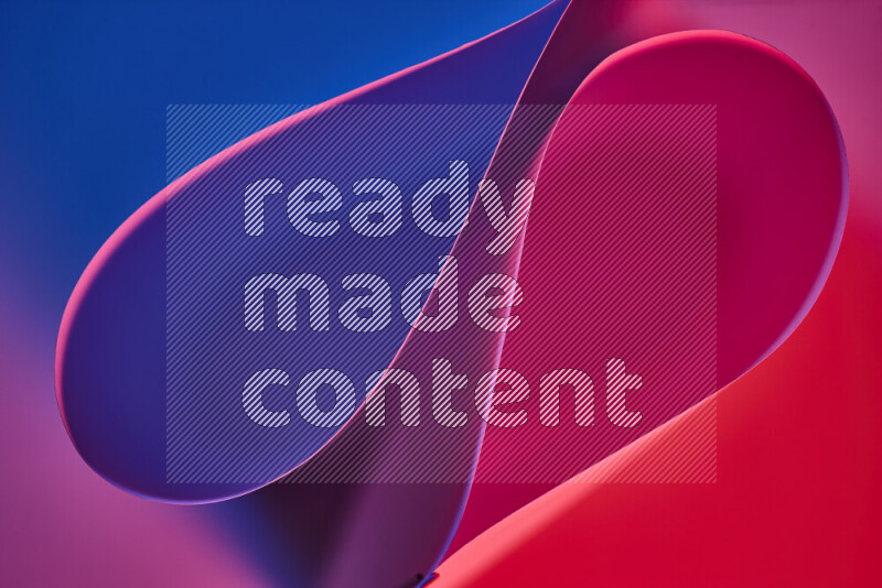An abstract art of paper folded into smooth curves in blue, purple and red gradients