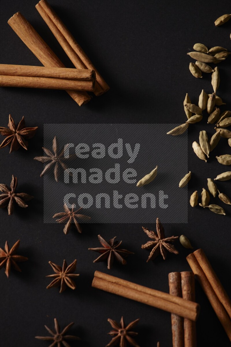 Cinnamon Sticks, Cardamom and star anise on a black background