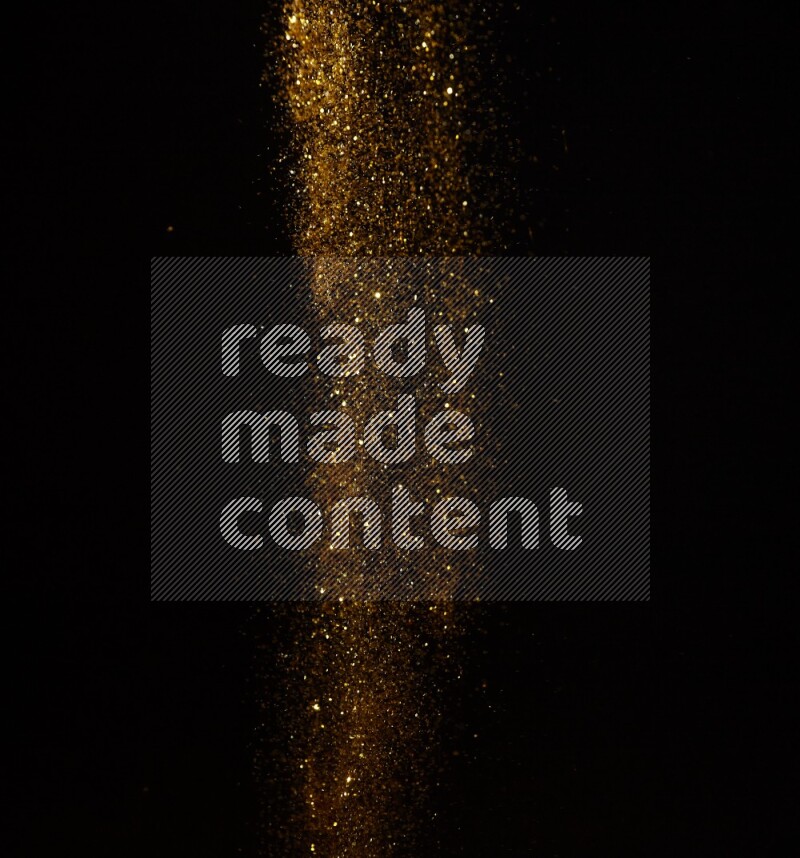 Gold glitter powder isolated on black background