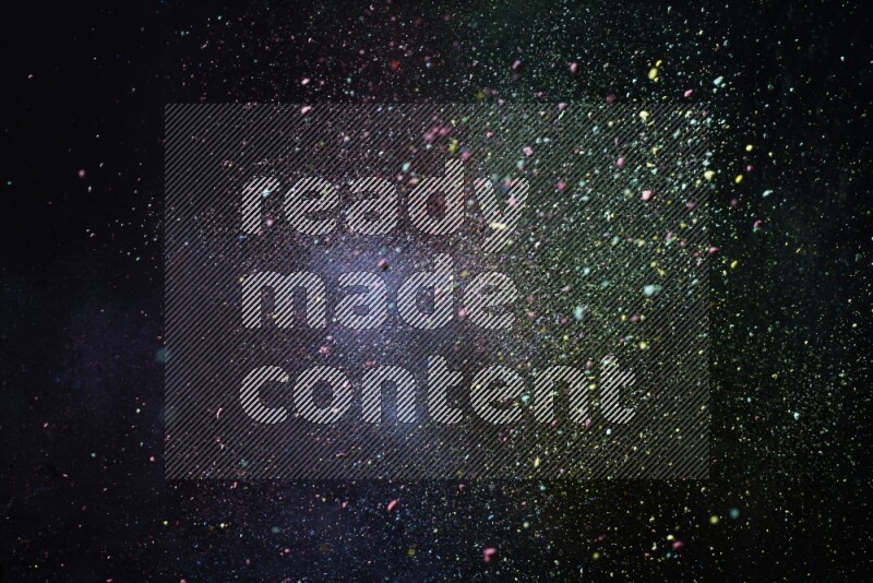 Colorful powder explosion on black background