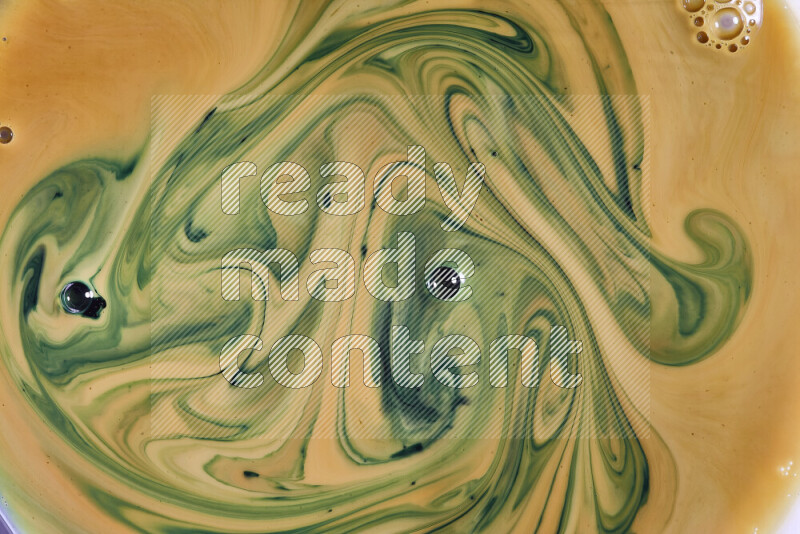 A close-up of abstract swirling patterns in orange and green