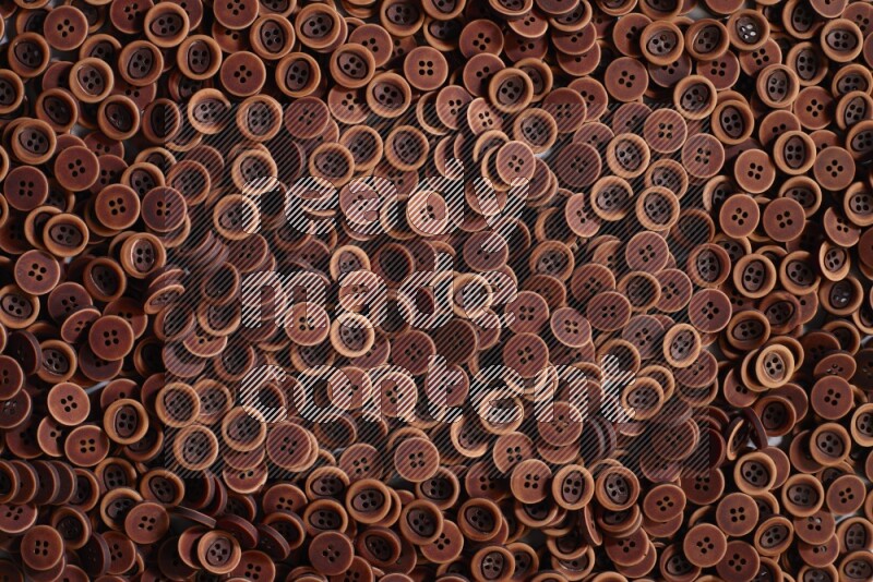 Wooden buttons placed on grey background