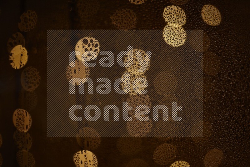 Bokeh light in yellow with water drops