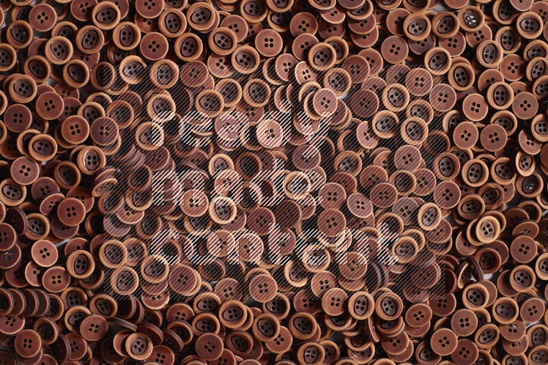 Wooden buttons placed on grey background
