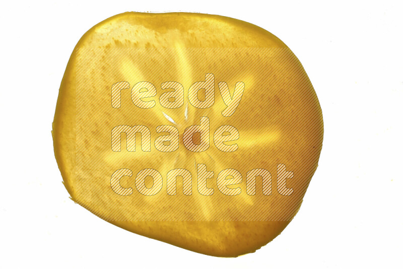 Persimmon slices on illuminated white background