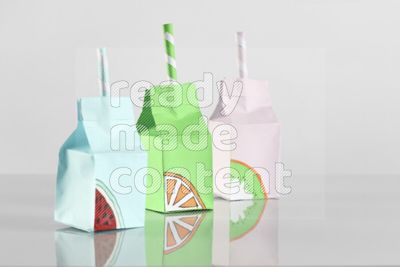 Origami juice box on grey background