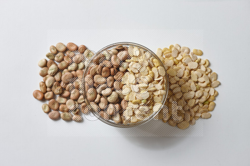 Fava beans with crushed beans on white background