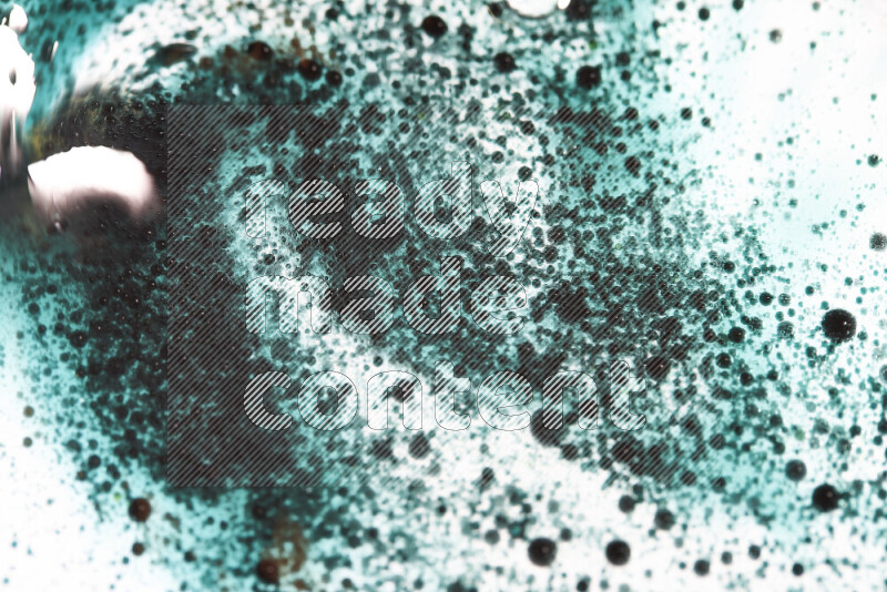 Close-ups of abstract green watercolor drops on oil Surface on white background