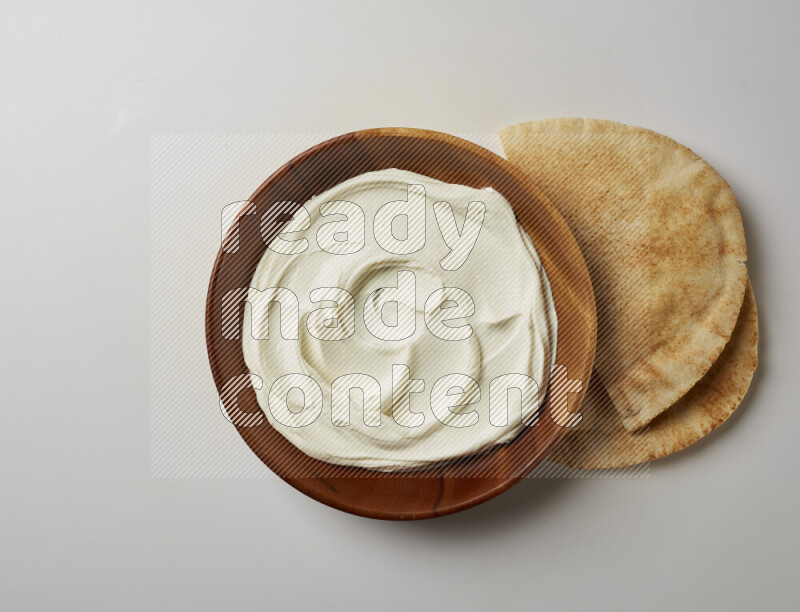 Plain Lebnah in a wooden plate on a white background