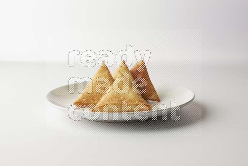 sambosas on a white background