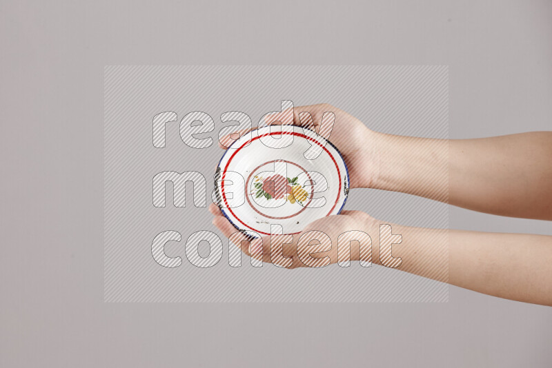Woman hands holding different metal essentials in different positions