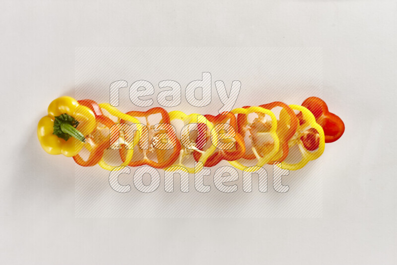 Assorted bell pepper slices on white background