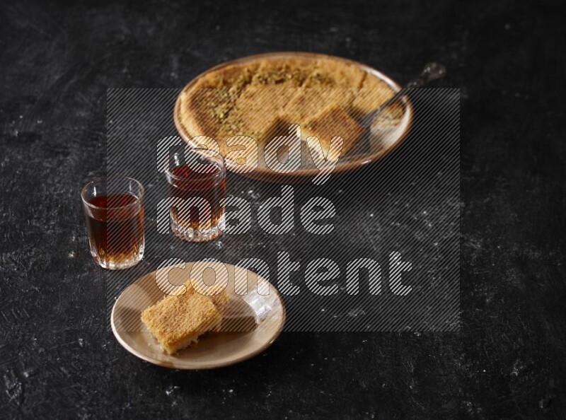 konafa with tea in a dark setup
