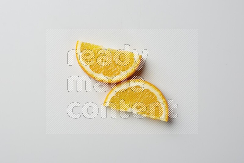 Two halves of an orange slices on white background
