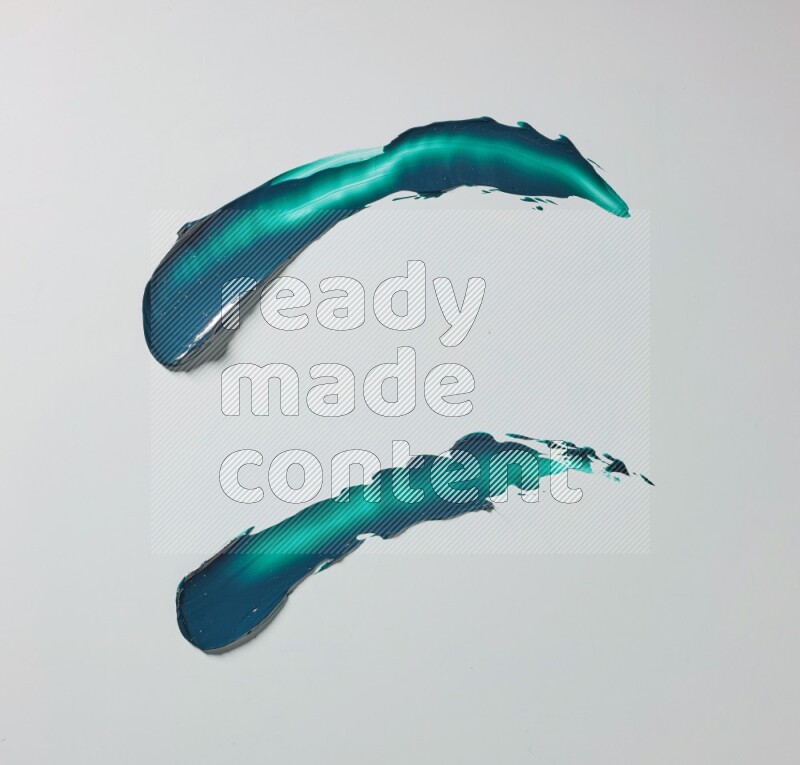 Turquoise curved painting knife strokes on white background