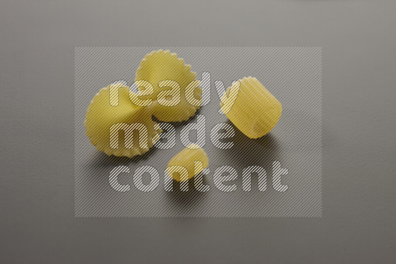 Different pasta types on grey background